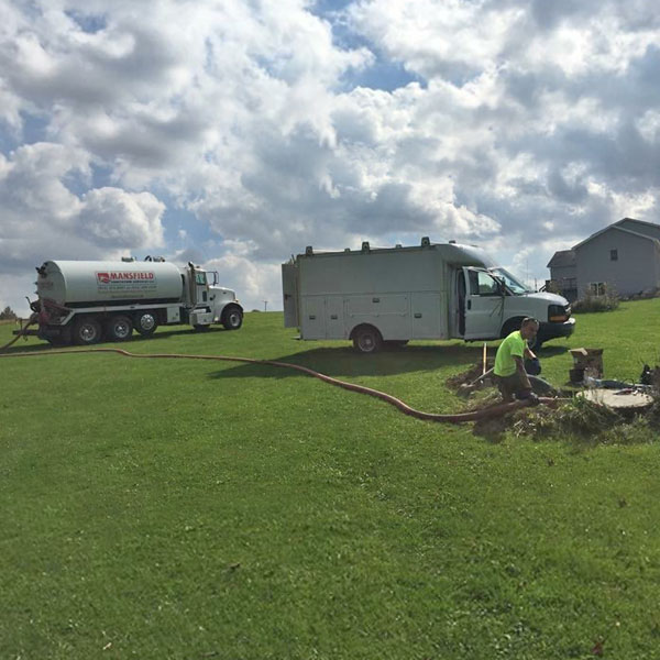 A Meadville Sanitation team cleaning a residential customer's drain in Meadville, PA.
